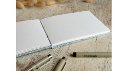 Carnet de croquis A6 fait main — Reliure copte, papier japonais | L'Atelier Reliure